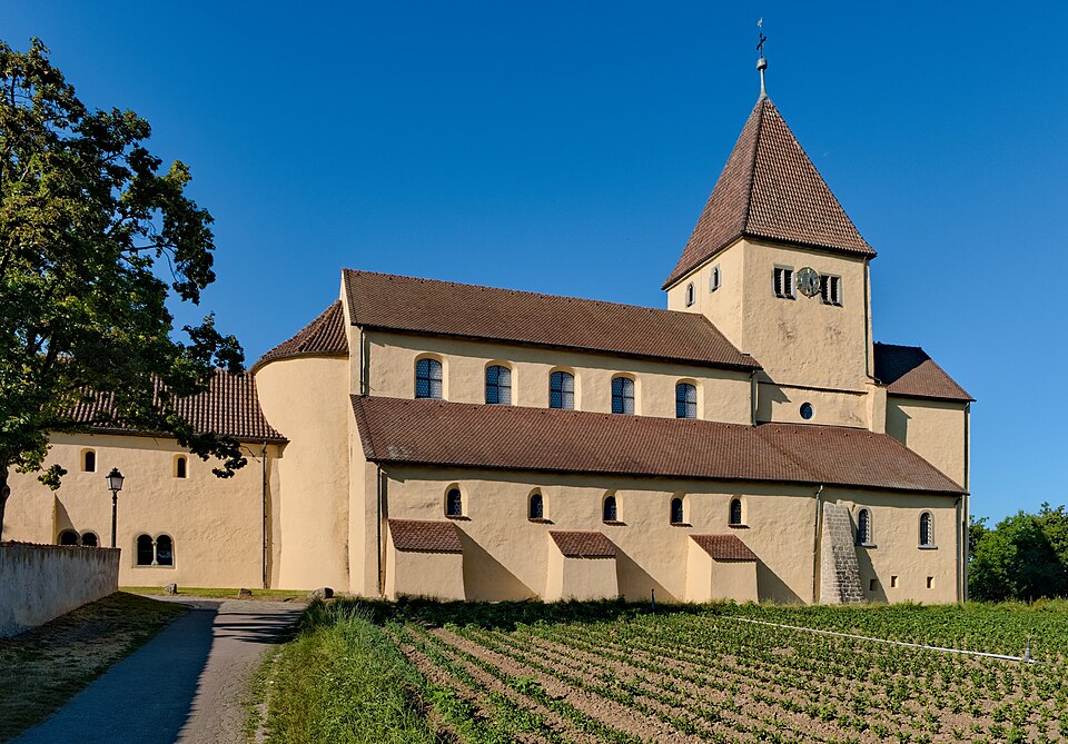 The Romanesque church of St Georg in Reichenau-Oberzell under a blue sky.